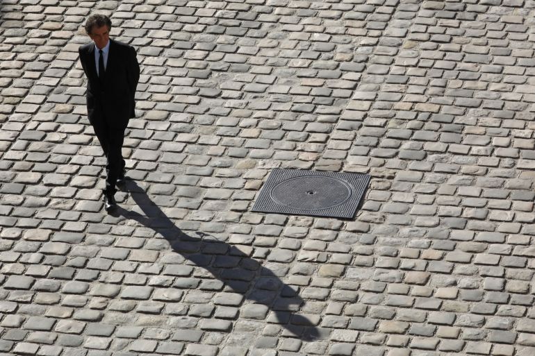 afp_698827cab04a-1770530762 (FILES) President of the Arab World Institute (IMA), and former French Culture minister Jack Lang leaves after attending the national homage for French-Armenian singer-songwriter Charles Aznavour at the Invalides in Paris on October 5, 2018.
