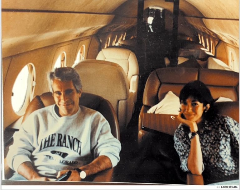 This undated photo provided by the US Justice Department on December 19, 2025 shows Jeffrey Epstein, a wealthy US financier who died in jail in 2019 while awaiting trial for sex trafficking underage girls, and his associate, Ghislaine Maxwell aboard a jet.