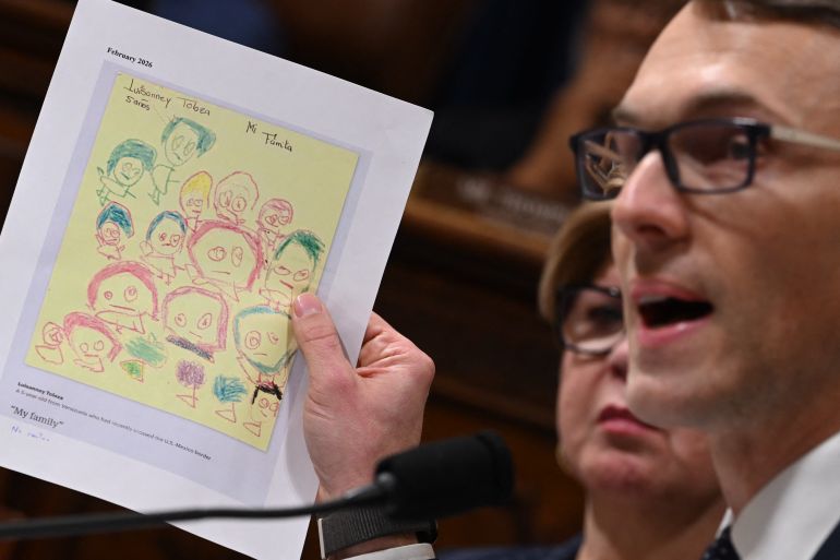 afp_698be2ee8573-1770775278 US Representative James Walkinshaw, Democrat from Virginia holds up a letter from a 5 year old detained in an federal facility during a House Committee on Homeland Security hearing on Oversight of the Department of Homeland Security on Capitol Hill in Washington, DC, on February 10, 2026.