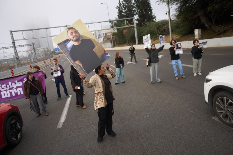 ap26041299608266-1770722292 Families and supporters of the Palestinian citizens of Israel block Ayalon freeway, calling for greater security amid rising crime in their communities, in Tel Aviv, Israel, Tuesday, Feb. 10, 2026. (AP Photo/Ariel Schalit)