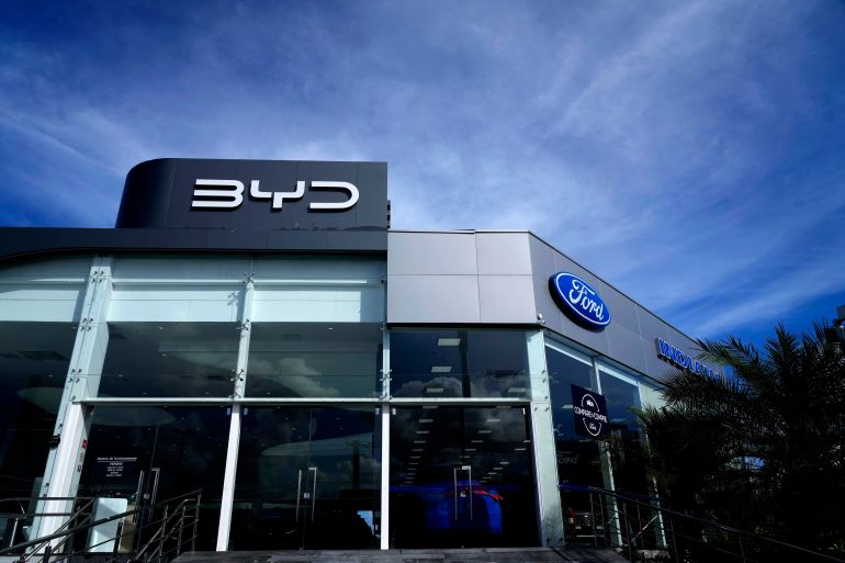 ap_69763a79d0d2e-1769355897 Signs are displayed for dealerships for BYD and Ford in Camacari, Bahia state, Brazil, Friday, March 7, 2025. (AP Photo/Eraldo Peres)
