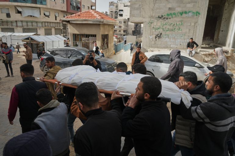 The bodies of Palestinians killed in an Israeli army strike on a police station are brought to Shifa Hospital in Gaza City Saturday, Jan. 31, 2026. (AP Photo/Jehad Alshrafi)