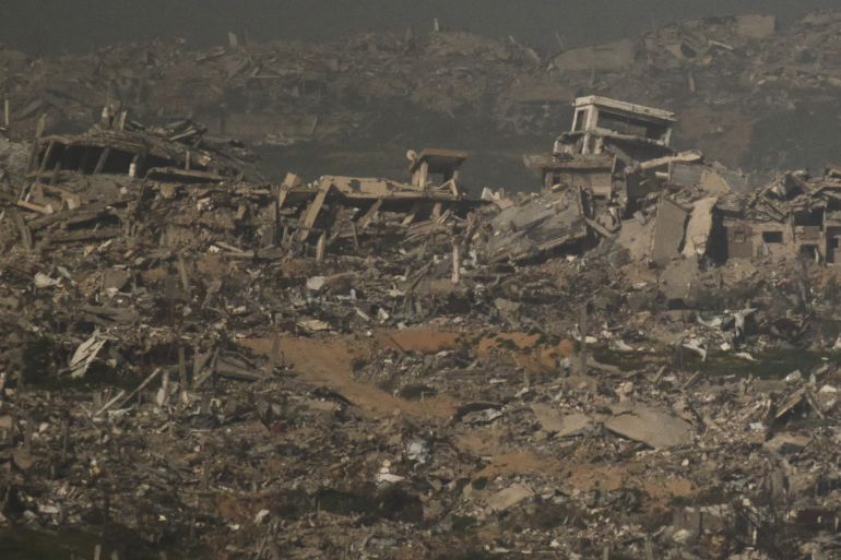 ap_6981fe96e26a1-1770126998 Buildings that were destroyed during the Israeli ground and air operations stand in the northern Gaza Strip as seen from southern Israel, Monday, Feb. 2, 2026. (AP Photo/Leo Correa)