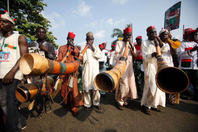 Supporters of presidential aspirant, Rabiu Musa Kwankwaso, sing and play locally made instruments during the All Progressive Congress party convention in Lagos, Nigeria,Wednesday, Dec. 10, 2014. The Feb. 14 presidential vote is expected to be the most closely contested since decades of military rule ended in 1999 in Africa's most populous nation and its biggest oil producer. (AP Photo/Sunday Alamba)