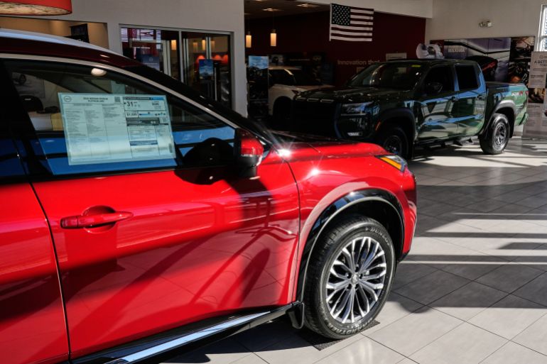 Nissan Rogue SUV is displayed on the main floor of a dealership lot, Thursday, Dec. 11, 2025, in Salem, N.H. (AP Photo/Charles Krupa)