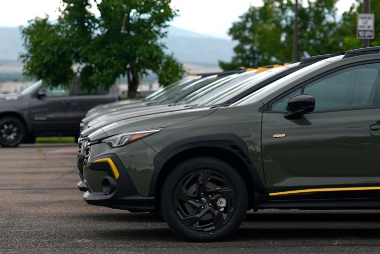 Unsold 2024 Crosstrek models sit on the lot of a Subaru dealership Tuesday, June 25, 2024, in Loveland, Colo. (AP Photo/David Zalubowski)