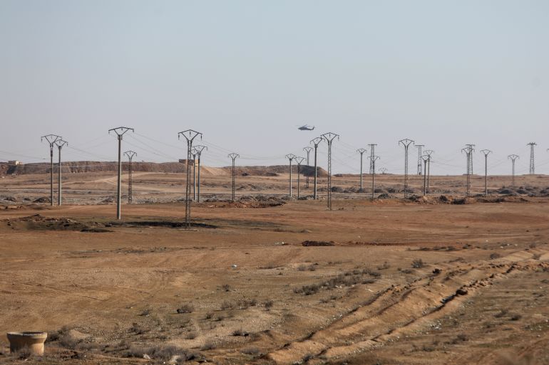 AL-SHADDADI, SYRIA - JANUARY 26: A US-led coalition forces helicopter operates near a base on January 26, 2026 in Al-Shaddadi, Syria. This month Syrian government forces have taken large parts of northern and eastern Syria from Kurdish forces in a rapid push that has brought nearly all of Syria under the control of the interim government of Ahmed al-Sharaa. The United States, which has long backed the Kurdish forces, viewing them as instrumental in the war against ISIS, has shifted its weight behind the new Syrian government, which seeks to integrate the Kurds into the national armed forces. (Photo by Abdulmonam Eassa/Getty Images)