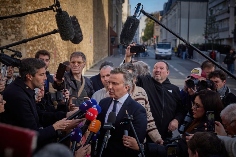 PARIS, FRANCE - OCTOBER 21: Lawyer for former French President Nicolas Sarkozy, Christophe Ingrain (C), addresses the media outside La Sante Prison as his client begins a five year prison sentence for criminal conspiracy on October 21, 2025 in Paris, France. The former French president (2007 and 2012) will serve five years for criminal conspiracy over a scheme to obtain election campaign funds from the regime of the late Libyan dictator Colonel Gaddafi. Sarkozy is the first former head of an EU country to serve time in prison, and the first French postwar leader to be jailed. (Photo by Kiran Ridley/Getty Images)