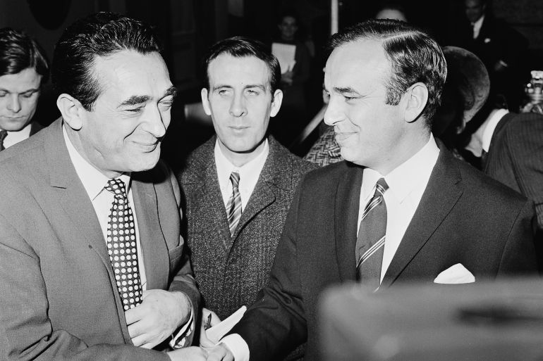 Rival publishers Robert Maxwell (1923  1991, left) and Rupert Murdoch shake hands during a vote on their respective bids for the News Of The World newspaper, at a shareholders' meeting at the Connaught Rooms, London, 2nd January 1969. The shareholders voted on whether to accept a share exchange deal with Murdoch's company, News Ltd, or approve a 34 million pound takeover bid by Pergamon Press, owned by Maxwell. The vote went in favour of Murdoch's offer. (Photo by Ronald Dumont/Daily Express/Hulton Archive/Getty Images)