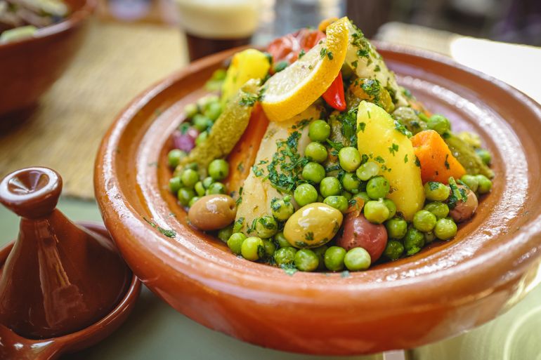 Close-up view of vegetables prepared in traditional Moroccan food Tajine, a Maghrebi dish named after the earthenware pot in which it is cooked. Morocco, North Africa.