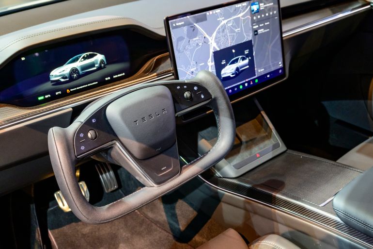 gettyimages-2256201096-1771680978 BRUSSELS, BELGIUM - JANUARY 09: Tesla Model S battery-electric, four-door full-size car interior with a Yoke steering wheel on the dashboard on display at the AutoSalon press preview on January 09, 2026 in Brussels, Belgium. The 102nd Brussels Motor Show has firmly established itself on the international calendar, featuring over 60 car brands and more than 20 motorcycle brands, and visited by over 270,000 people. (Photo by Sjoerd van der Wal/Getty Images)