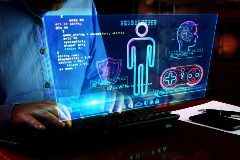 gyu678uyg-1771076845 Man typing on keyboard with game creating on hologram screen by Skórzewiak @ادوبي ستوك