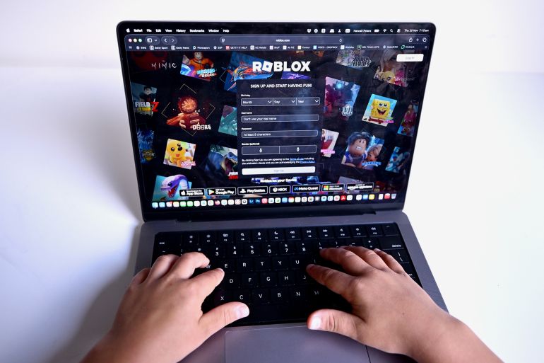 gyu7yh-1770025353 AUCKLAND, NEW ZEALAND - NOVEMBER 19: A child is seen playing a game on the Roblox platform on November 19, 2025 in Auckland, New Zealand. Roblox will block in-game chat for users under 13 unless they complete mandatory age verification, tightening safety controls across the platform. The changes will take effect in Australia, New Zealand and the Netherlands in December, and the rest of the world in January, 2026. (Photo by Hannah Peters/Getty Images)