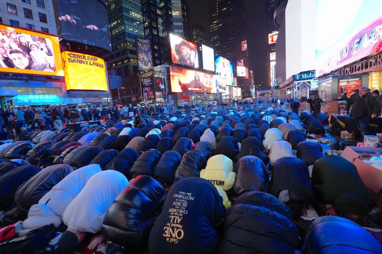 iftar4-1772095582 NEW YORK, UNITED STATES - FEBRUARY 20: Muslim men and women gather to break their fast, perform Tarawih prayer, and observe Ramadan, continuing an annual tradition that began in 2022, at Times Square in New York, United States on February 20, 2026. (Photo by Selcuk Acar/Anadolu via Getty Images)