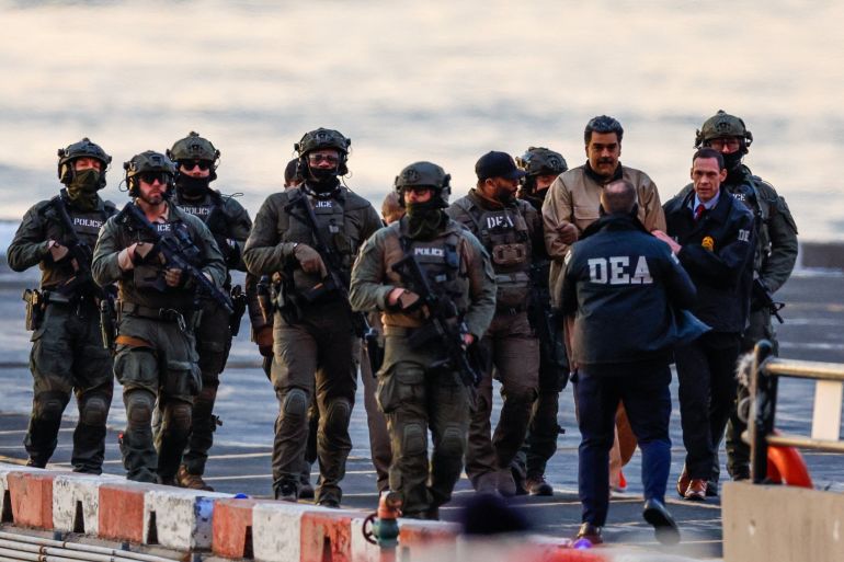 Captured Venezuelan President Nicolas Maduro arrives at the Downtown Manhattan Heliport, as he heads towards the Daniel Patrick Manhattan United States Courthouse for an initial appearance to face U.S. federal charges including narco-terrorism, conspiracy, drug trafficking, money laundering and others in New York City, U.S., January 5, 2026. REUTERS/Eduardo Munoz