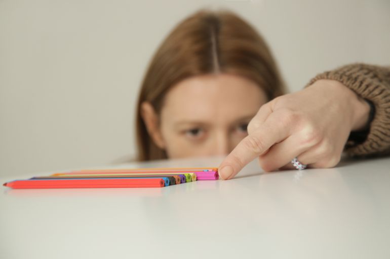 Problem with Perfectionism. Woman suffers from Obsessive Compulsive Disorder, OCD.