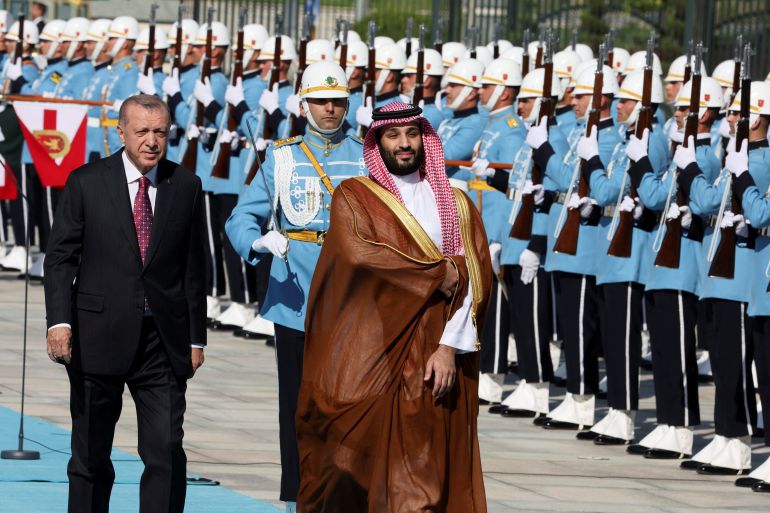Turkish President Tayyip Erdogan and Saudi Crown Prince Mohammed bin Salman review a guard of honour during a welcome ceremony at the Presidential Palace in Ankara, Turkey, June 22, 2022. REUTERS/Umit Bektas
