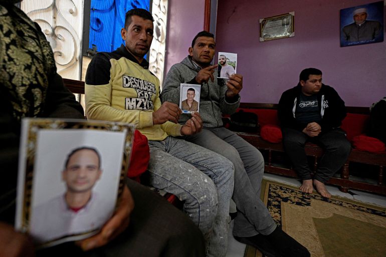 "ادفعوا وإلا مات ابنكم": هكذا يرعب المهربون العوائل المصرية Relatives hold portraits of (L to R) Ahmed Kamel (29), Adel Hamed (37), and Mohamed Abdelsamad (32), who are believed to have gone missing in the Mediterranean sea while making the journey to Europe through Libya, during an interview at the Abdallah Aziza village near the town of Minya al-Qamh Egypt's central Nile delta province of Sharqiya on January 21, 2026. More than 17,000 Egyptians reached Europe via the Mediterranean last year, while 1,328 people of all nationalities died or disappeared on the world's deadliest migration route, according to Frontex and the UN. In recent years, a currency collapse and soaring inflation have deepened poverty nationwide, leaving much of Egypt's over 50 million young people under 30 feeling they have no future at home. (Photo by Khaled DESOUKI / AFP)