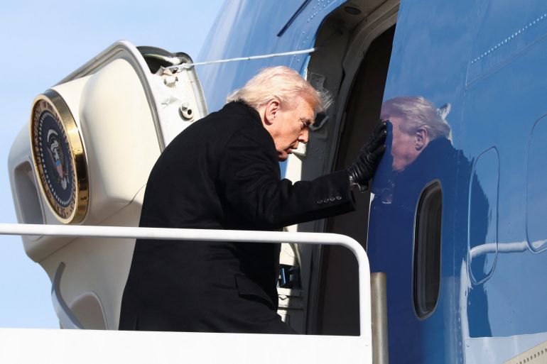 reuters_6984f9b4-1770322357 U.S. President Donald Trump boards Air Force One as he departs from Joint Base Andrews in Maryland, U.S., January 27, 2026. REUTERS/Kevin Lamarque