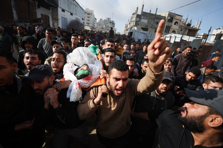 reuters_698c8eb3-1770819251 SENSITIVE MATERIAL. THIS IMAGE MAY OFFEND OR DISTURB Mourners carry the body of one of Palestinians, who, according to medics, were killed by an Israeli strike on Monday, during their funeral, in Gaza City, February 10, 2026. REUTERS/Dawoud Abu Alkas