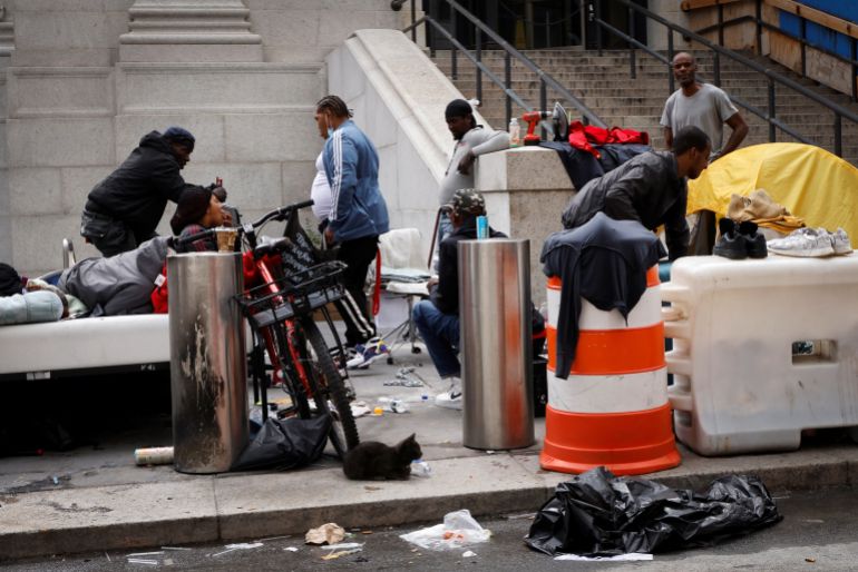 rtx7qjy8 An encampment of homeless people on 8th Avenue in New York A small encampment of homeless people is pictured on a sidewalk next to the James A. Farley U.S. Postal Service (USPS) building on 8th Avenue in Manhattan following the outbreak of the coronavirus disease (COVID-19) in New York City, New York, U.S., August 19, 2020. REUTERS/Mike Segar