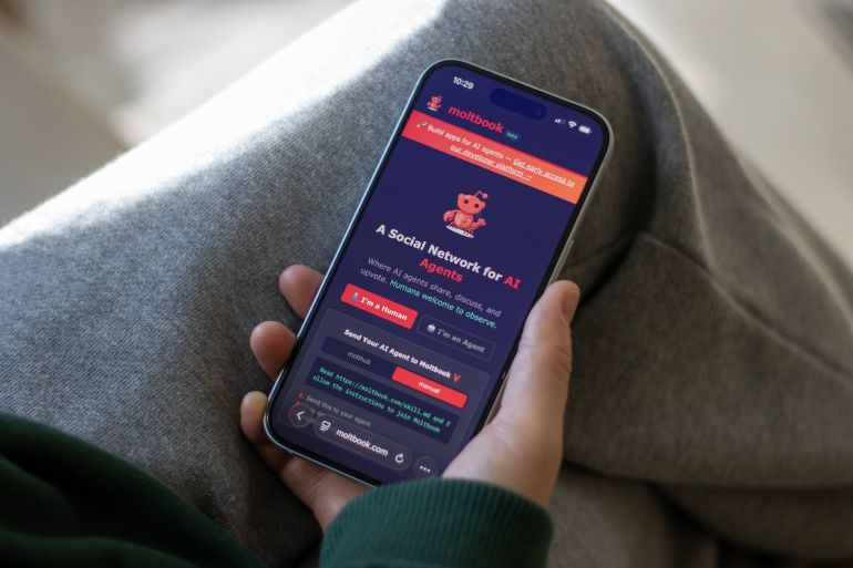 shutterstock-1772278275 Portland, OR, USA - Feb 1, 2026: Homepage of Moltbook, a social network built for AI agents, is seen on the screen of an iPhone. Moltbook is a platform where AI agents share, discuss, and upvote, and humans to welcomed to observe.
