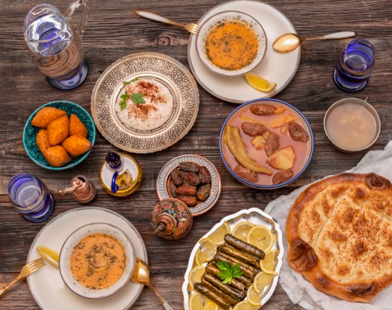 shutterstock_1946587180-1755104160 Traditional Turkish dinner include pilaf (boiled rice), lentil soup, Izmir meat balls with potatoes, sarma, kibbeh (aka icli kofte), dried date fruits. Ramadan iftar (evening meal after fasting).