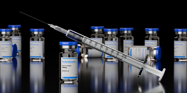 Numerous testosterone steroid vials with syringe leaning on the one in front on black background, anabolic steroid for muscle growth , selective focus, 3D illustration