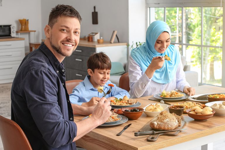 shutterstock_2587747295-1771873274 Muslim family having dinner together. Ramadan celebration; Shutterstock ID 2587747295; purchase_order: aj; job: ; client: ; other: