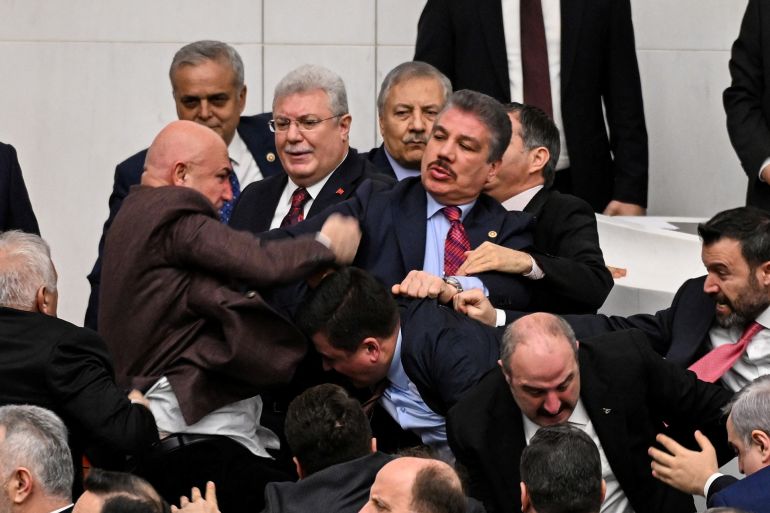 t67ugh-1770877863 Lawmakers from the main opposition Republican People’s Party (CHP) scuffle with members of the ruling AK Party during a protest over newly appointed Justice Minister Akin Gurlek (not pictured), at the Parliament in Ankara, Turkey, February 11, 2026. REUTERS/Stringer TURKEY OUT. NO COMMERCIAL OR EDITORIAL SALES IN TURKEY.
