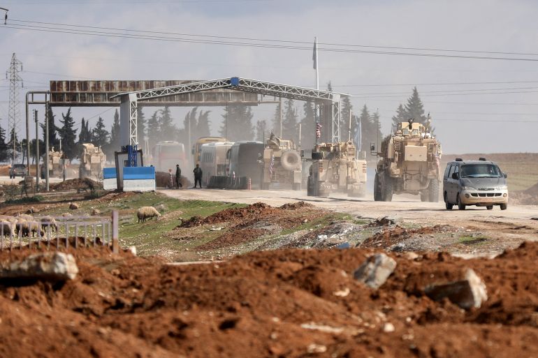 tututut1254-1771161640 FILE PHOTO: U.S. military vehicles escort buses transporting Islamic State detainees from Syria to Iraq, according to a security source from the Syrian Democratic Forces, in Qamishli, Syria, February 8, 2026. REUTERS/Orhan Qereman/File Photo
