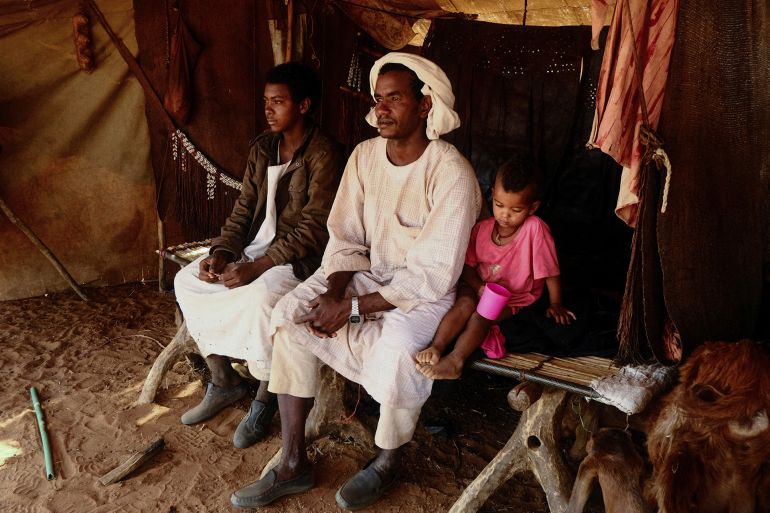 Nomadic herders sit on a bed made of tree trunks inside their tent, El Obeid, North Kordofan, Sudan, January 20, 2026. REUTERS/El Tayeb Siddig