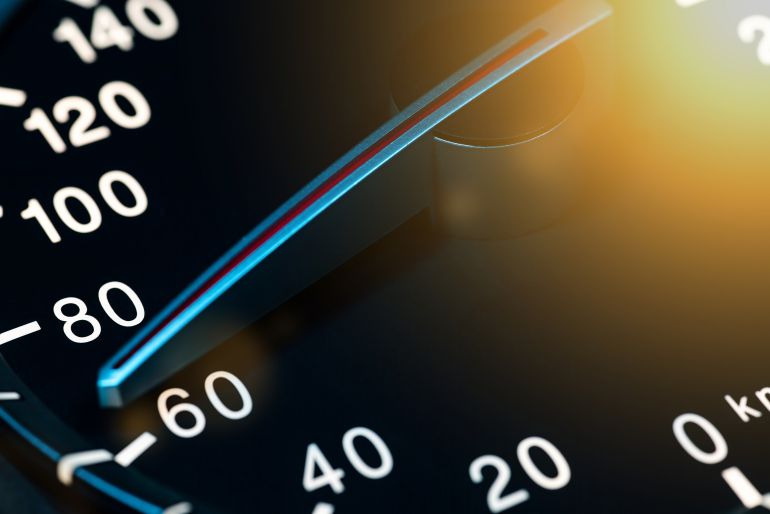 00001speed-1773551351 Close-up of car speedometer needle pointing at 60 kmh, indicating moderate speed