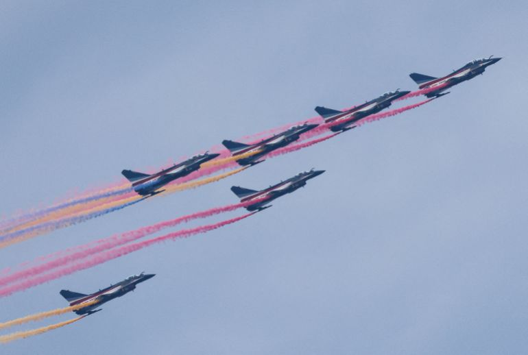 J-10 fighter jets of the Chinese People's Liberation Army (PLA) Air Force's Bayi aerobatic team release colored smoke during a flypast rehearsal ahead of military parade to mark the 80th anniversary of the end of World War Two, in Beijing, China August 24, 2025. REUTERS/Maxim Shemetov TPX IMAGES OF THE DAY