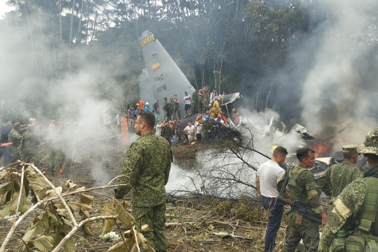 Members of the military gather at the site of a Colombian military plane crash in Puerto Leguizamo, Putumayo, Colombia March 23, 2026. La Voz de Amazonia/Mare Rafue/Handout via REUTERS THIS IMAGE HAS BEEN SUPPLIED BY A THIRD PARTY. MANDATORY CREDIT VERIFICATION: Topography mapping and nearby buildings matched satellite imagery Date verified by original file metadata Defense Minister Pedro Sanchez said the accident happened as the Lockheed Martin-built LMT.N Hercules C-130 was taking off from Puerto Leguizamo on the border with Peru