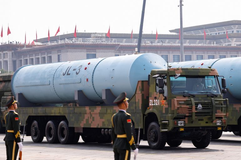 Members of the People's Liberation Army stand as the strategic strike group displays JL-3 intercontinental-range submarine-launched ballistic missiles during a military parade to mark the 80th anniversary of the end of World War Two, in Beijing, China, September 3, 2025. REUTERS/Tingshu Wang