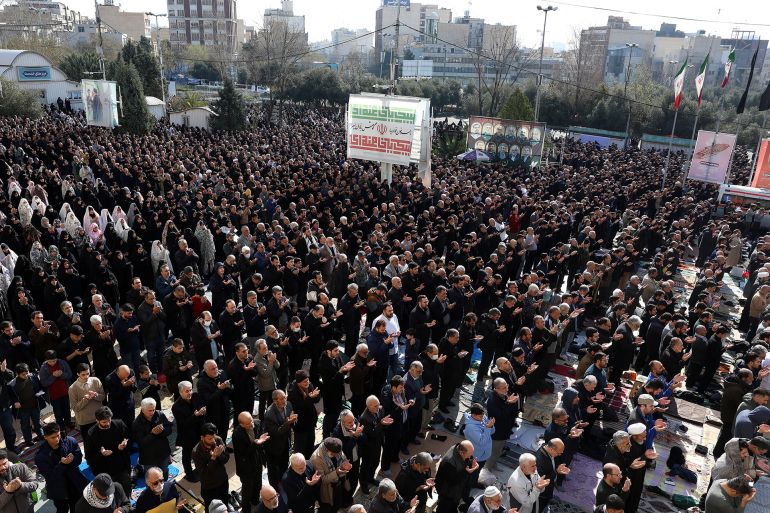 Iranian Shias take part in Eid al-Fitr prayers, marking the end of the Muslim holy month of Ramadan, at the Grand Mosalla mosque in Tehran on March 21, 2026.
