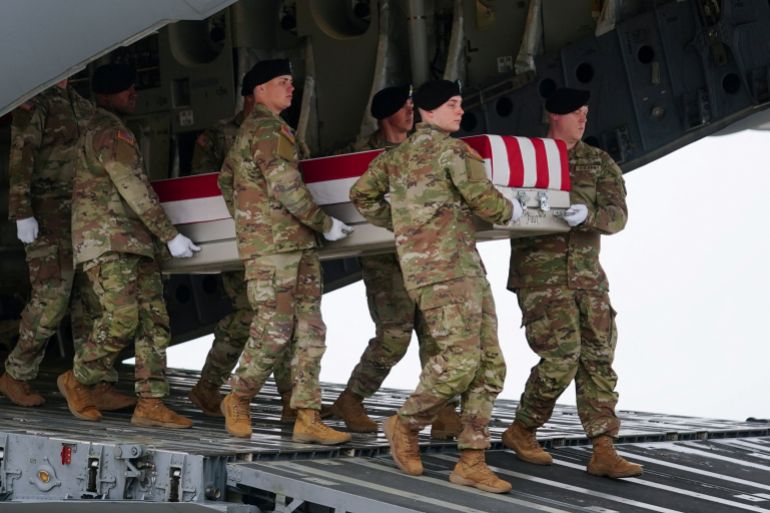 Members of the military carry a transfer case during a dignified transfer of the remains of six U.S. Army service members of the 103rd Sustainment Command, who were killed in Kuwait, Major Jeffrey O'Brien, Capitain Cody Khork, Chief Warrant Officer 3 Robert Marzan, Sergeant 1st Class Nicole Amor, Sergeant 1st Class Noah Tietjens and Sergeant Declan Coady, amid the U.S.-Israeli conflict with Iran, at Dover Air Force Base in Dover, Delaware, U.S., March 7, 2026. REUTERS/Nathan Howard