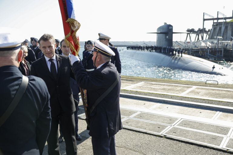 France's President Emmanuel Macron greets French Navy members upon his arrival to visit to the Nuclear Submarine Navy Base of Ile Longue in Crozon, north-western France on March 2, 2026.