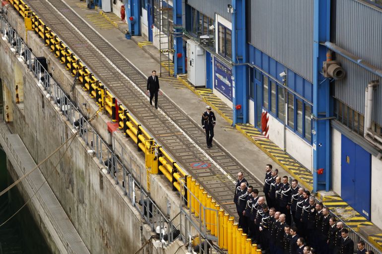 France's President Emmanuel Macron (L) takes part in a visit to the Nuclear Submarine Navy Base of Ile Longue in Crozon, north-western France on March 2, 2026.