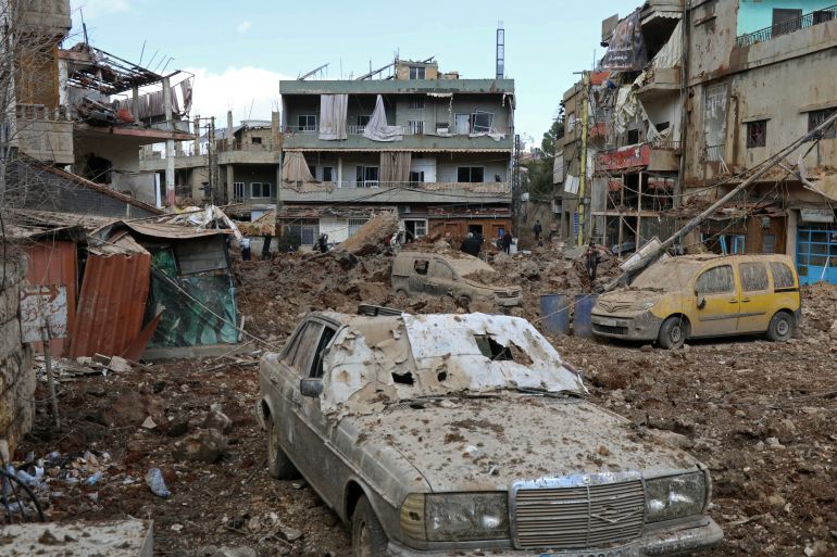 TOPSHOT - This photograph taken during a media tour organised by the Hezbollah shows people inspecting the destruction at Nabi Sheet town after an Israeli military operation in the Bekaa Valley of Lebanon, on March 7, 2026.