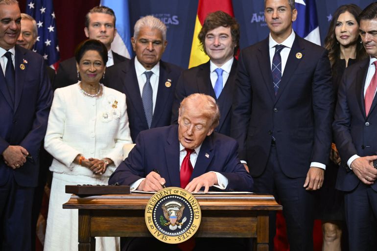 US President Donald Trump signs a proclamation at the "Shield of the Americas" Summit at Trump National Doral in Miami, Florida, March 7, 2026.