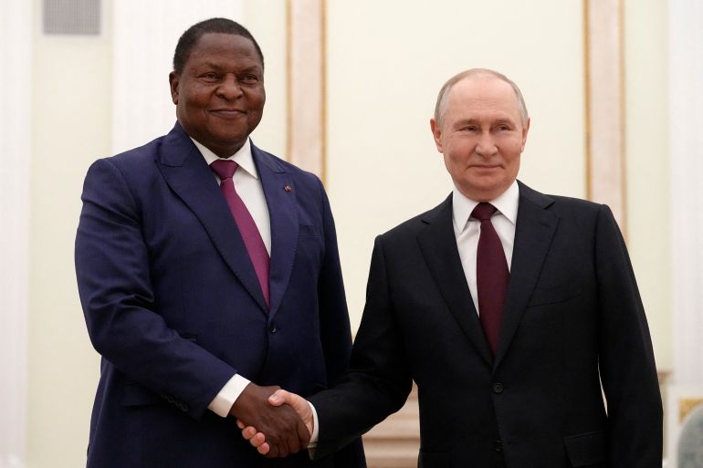 afp_69ad2741d4fc-1772955457-1 Russian President Vladimir Putin, (R) and Central African Republic President Faustin-Archange Touadera shake hands during their theatre meeting at the Kremlin in Moscow on March 5, 2026. (Photo by Alexander Zemlianichenko / POOL / AFP)