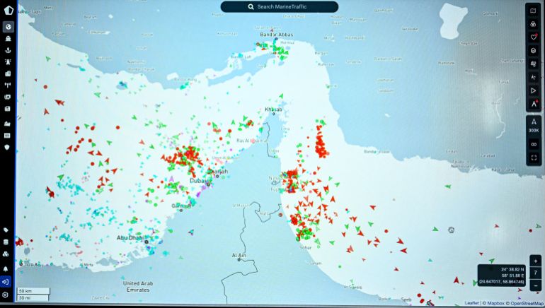 This photograph shows a page on the Marinetraffic website thats shows commercial boats traffic on the edge of the Strait of Hormuz near the Iranian coast, in Paris on March 4, 2026. (Photo by JULIEN DE ROSA / AFP)