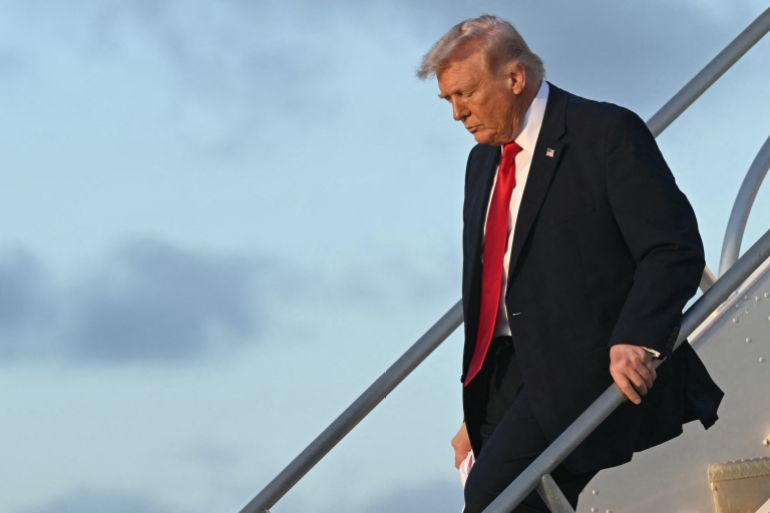US President Donald Trump disembarks from Air Force One upon arrival at Miami International Airport in Miami, Florida, on March 7, 2026, after traveling to Dover Air Force Base for a dignified transfer solemn event for six US soldiers killed in an Iranian strike in Kuwait. (Photo by SAUL LOEB / AFP)