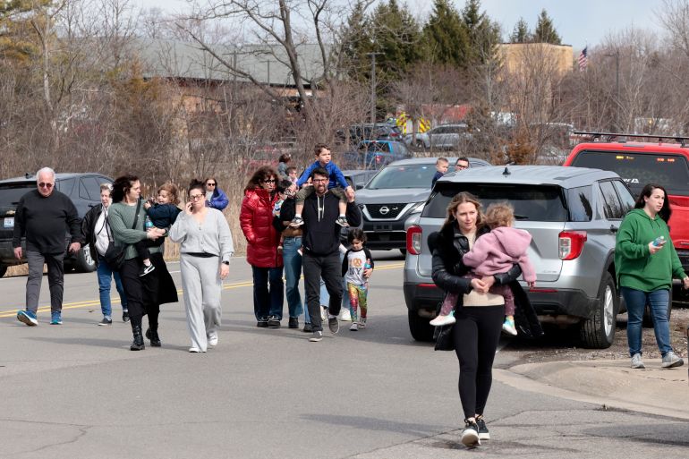 Families leave after being reunited outside Temple Israel synagogue after an assailant rammed his truck into the building in West Bloomfield, Michigan, a suburb of Detroit, on March 12, 2026.