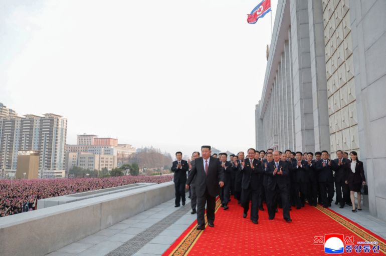 afp_69c21bfc89a9-1774328828 This picture taken on March 23, 2026 and released by North Korea's official Korean Central News Agency (KCNA) on March 24, 2026 shows North Korean leader Kim Jong Un (C) heading toward the venue for a commemorative performance following the conclusion of the First Session of the 15th Supreme People's Assembly in Pyongyang.