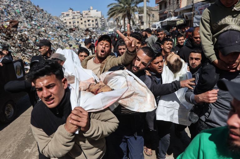 EDITORS NOTE: Graphic content / Mourners carry the bodies of Fahmi and Saed Qaddoum, two displaced Palestinian brothers reportedly killed earlier in the day in an Israeli airstrike on Gaza City's Shujaiya neighbourhood, during their funeral in Gaza City March 28, 2026.