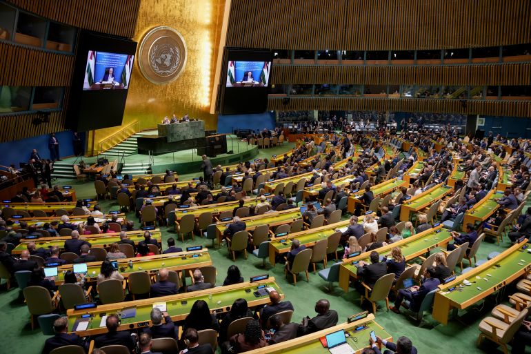 ap25265732284081-1758573029 Palestinian President Mahmoud Abbas appears on a screen as he speaks virtually during a high-profile meeting at the United Nations aimed at galvanizing support for a two-state solution to the Israeli-Palestinian conflict Monday, Sept. 22, 2025, at UN headquarters. (AP Photo/Angelina Katsanis) الأمم المتحدة - حل الدولتين