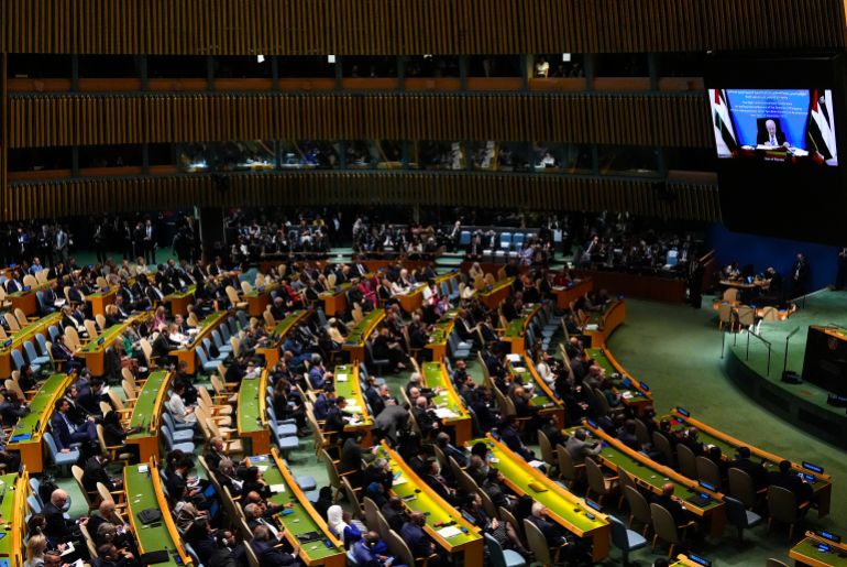Palestinian President Mahmoud Abbas appears on a screen as he speaks virtually during a high-profile meeting at the United Nations aimed at galvanizing support for a two-state solution to the Israeli-Palestinian conflict Monday, Sept. 22, 2025, at UN headquarters (AP Photo/Yuki Iwamura) حل الدولتين - الأمم المتحدة - محمود عباس